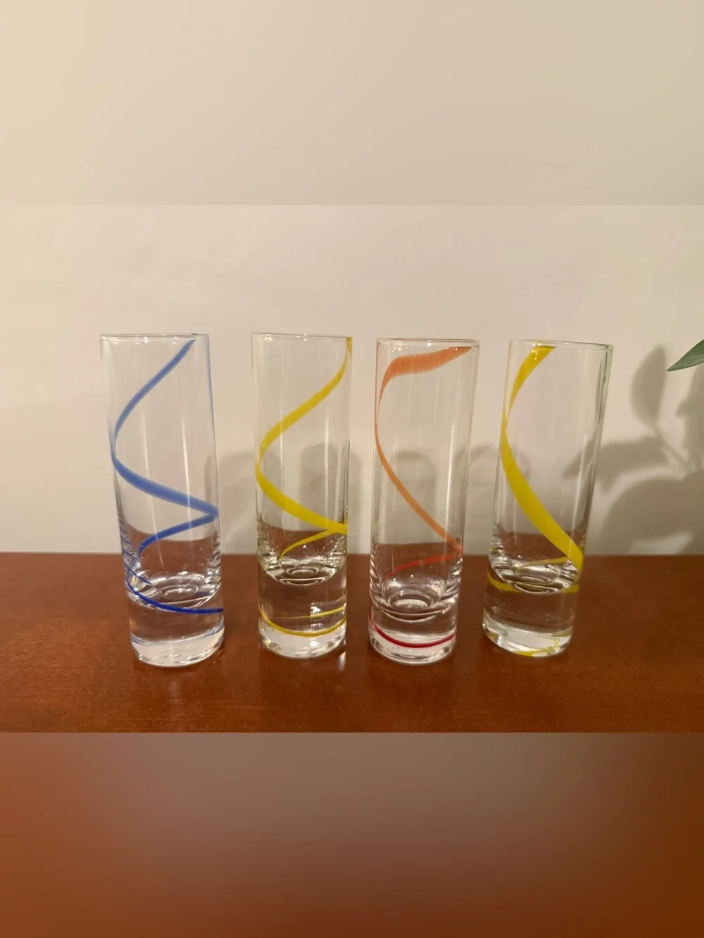 Set of Clear Spiral shot glasses in Yellow and Orange and blue